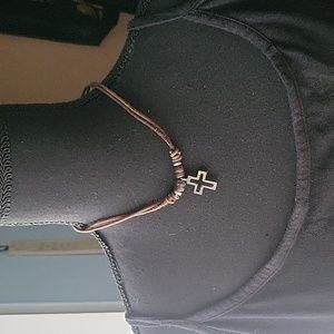Cross with leather necklace.